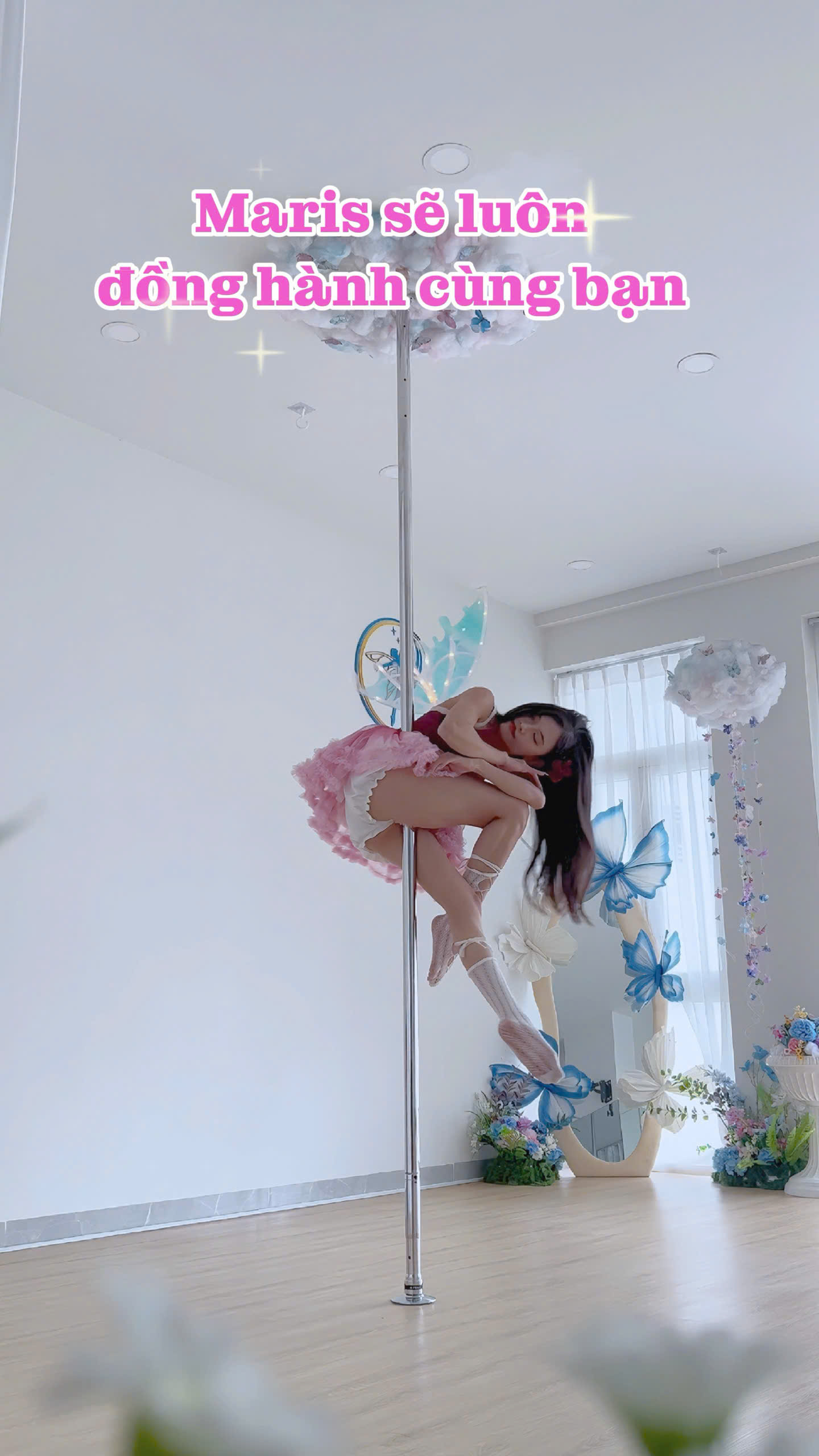 Fairy-inspired pole pose in studio